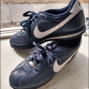 navy blue leather cortez